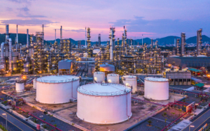 Refinery In The Mountains At Sunset