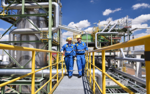 Two Workers Ontop Of Chemical Plant